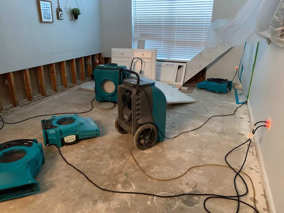 Dehumidifier in flood-cut room for Water Damage Restoration in Economy